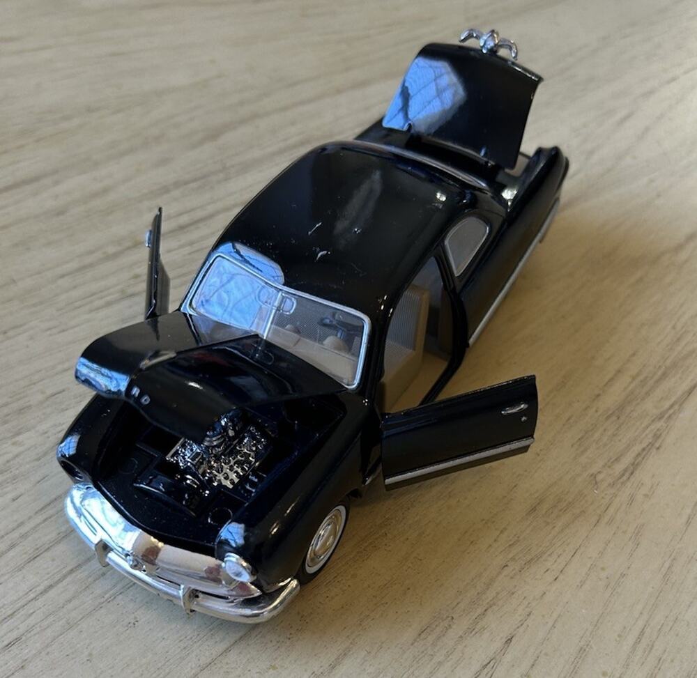 The Ford Motor Company Die Cast 1949 Model Ford Coup Black Toy Car Wheels Roll